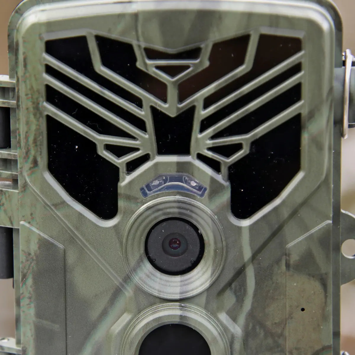 Front view of 4K trail camera with active lens and rugged camouflage housing.