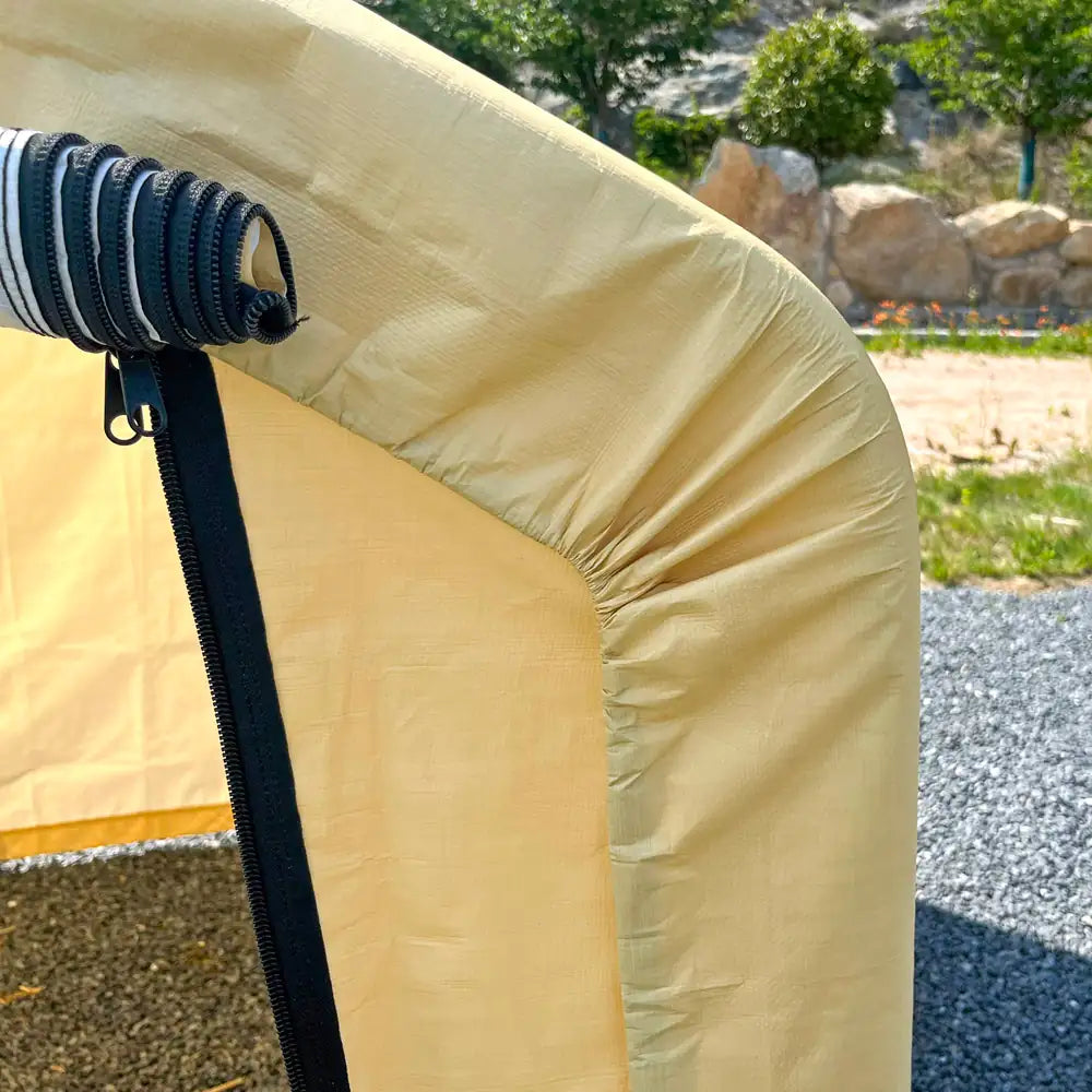 Beige inflatable boat with a black strap and buckle on a natural background