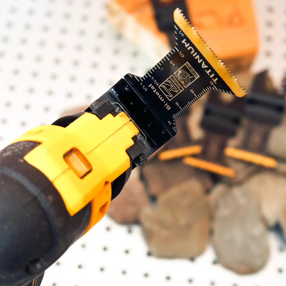 Close-up of a power tool with a blade attachment on a blurred background