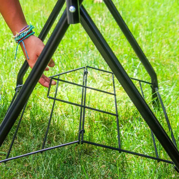 Unlock the mesh shelf to fold the saddle rack