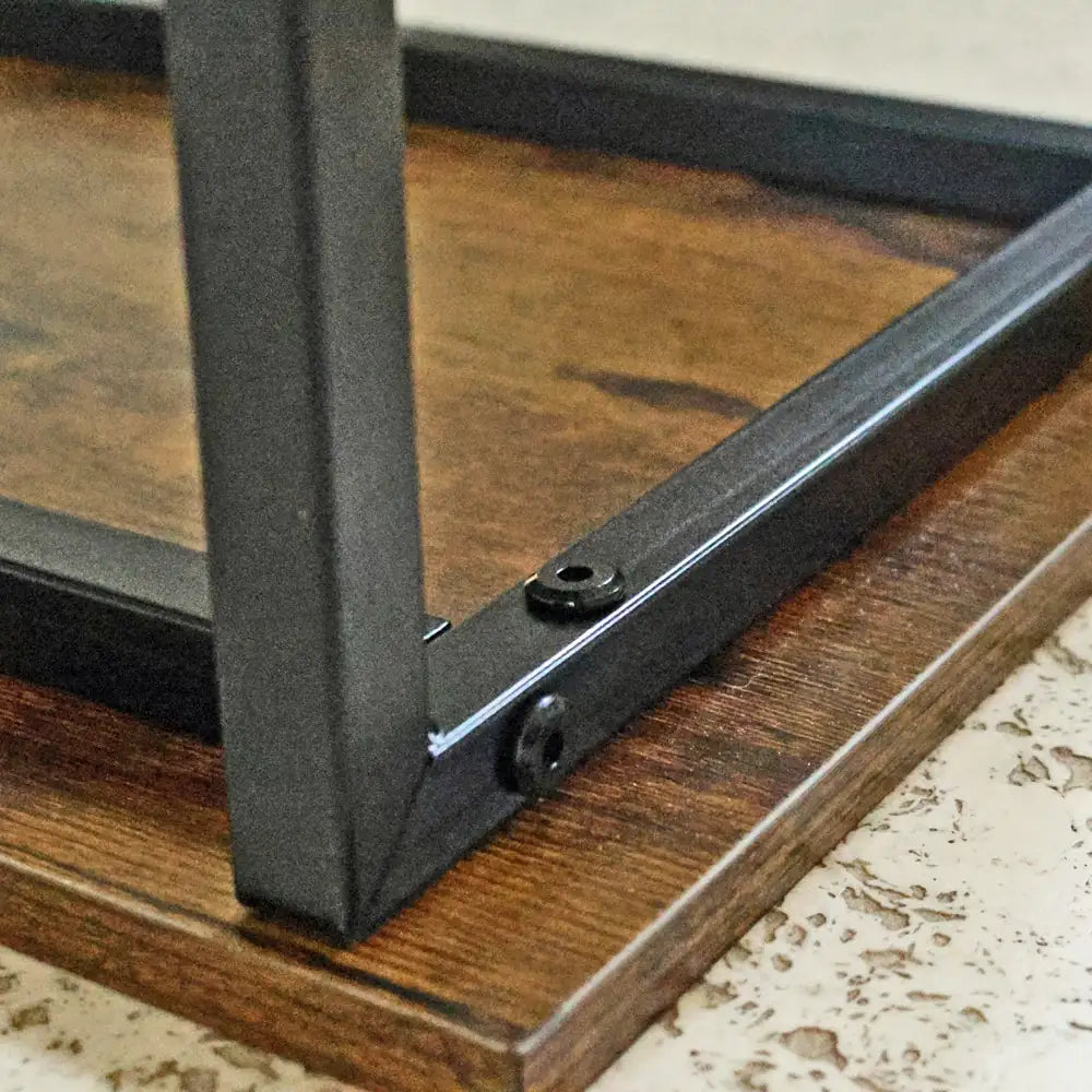 Close-up of a wooden surface with a metal bracket attached