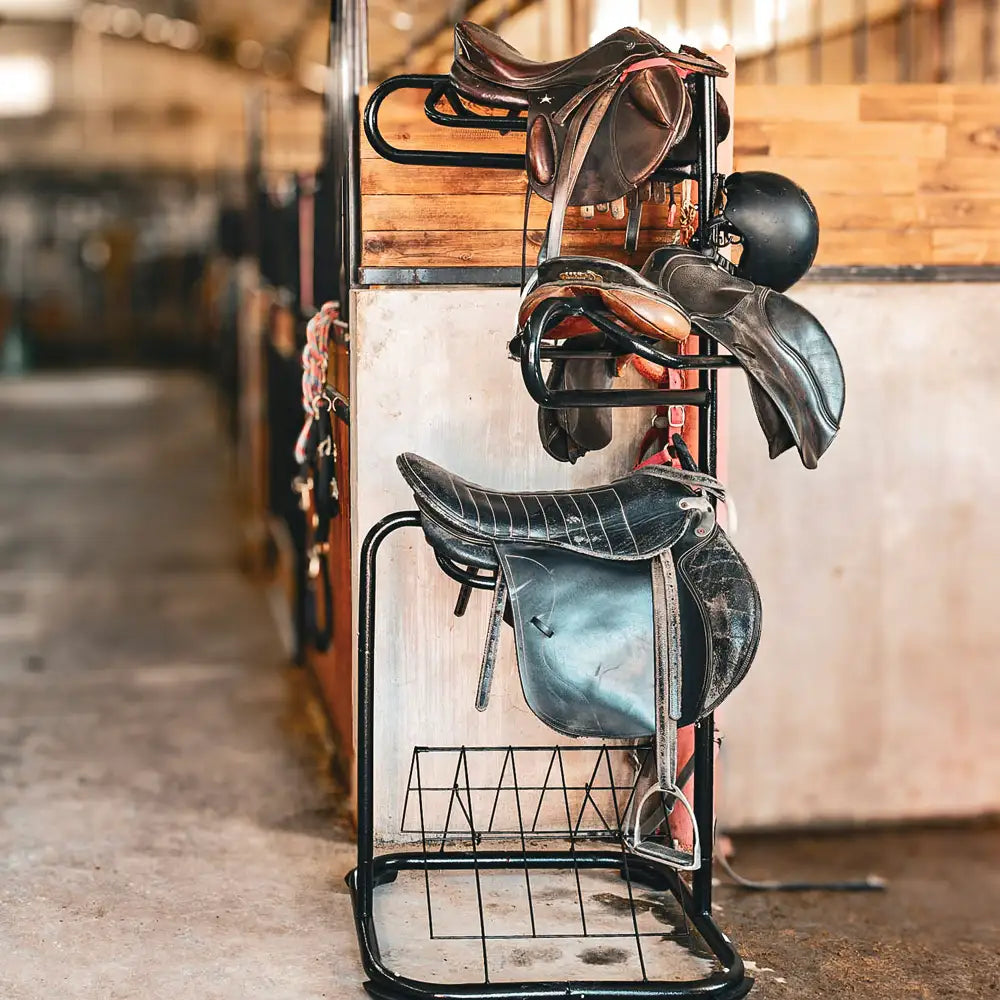 Western saddle on 3-tier rotating saddle stand - horse tack storage solution