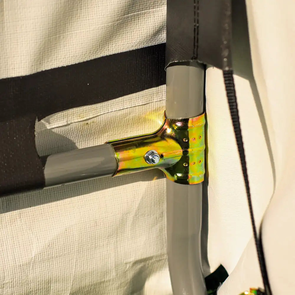 Close-up of a handlebar with a gold and gray design on a beige background