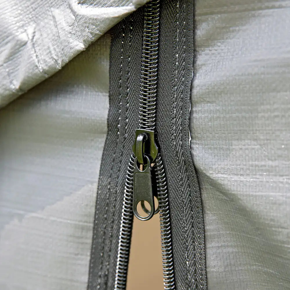 Close-up of a zipper on a textured fabric surface