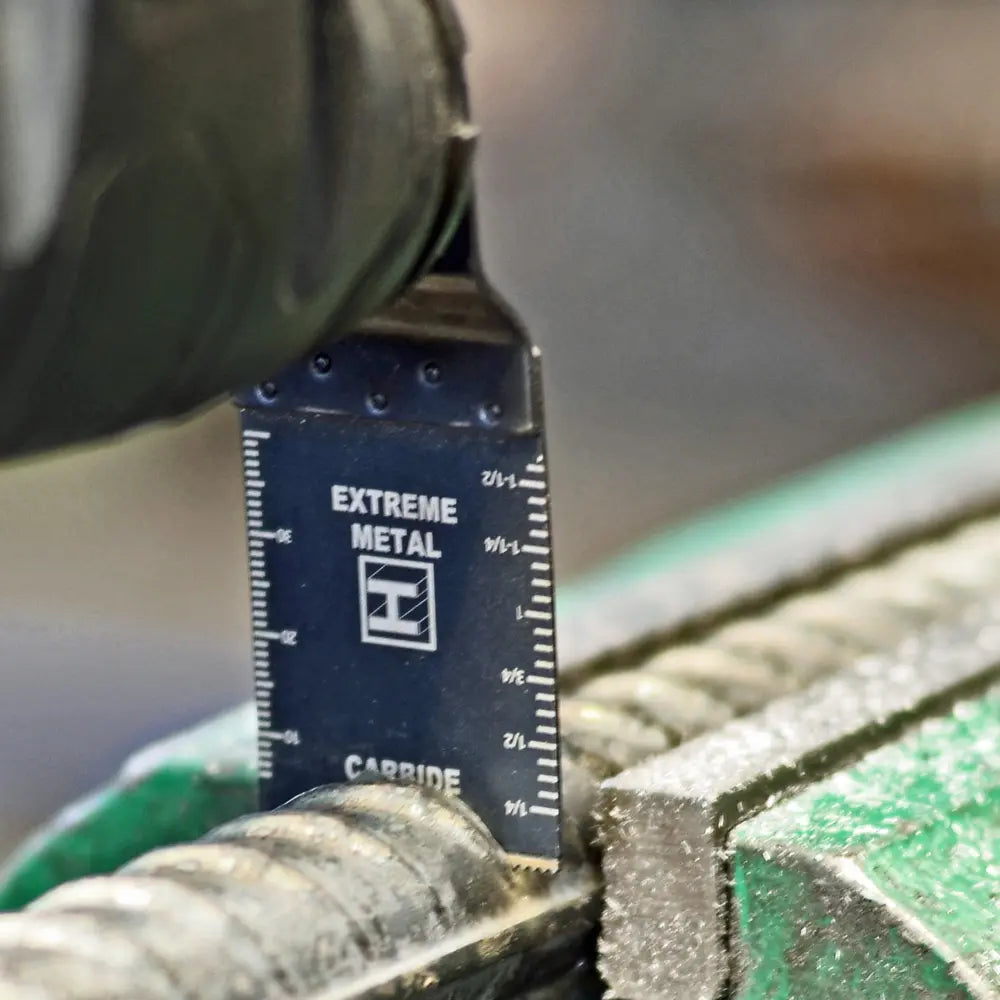 Close-up of a drill bit with a 'Extreme Metal' carbide gauge on a blurred background