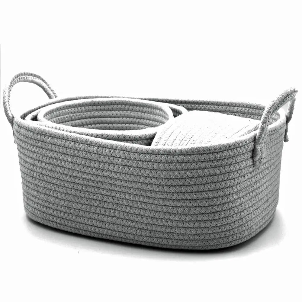 Gray woven basket with handles on a white background