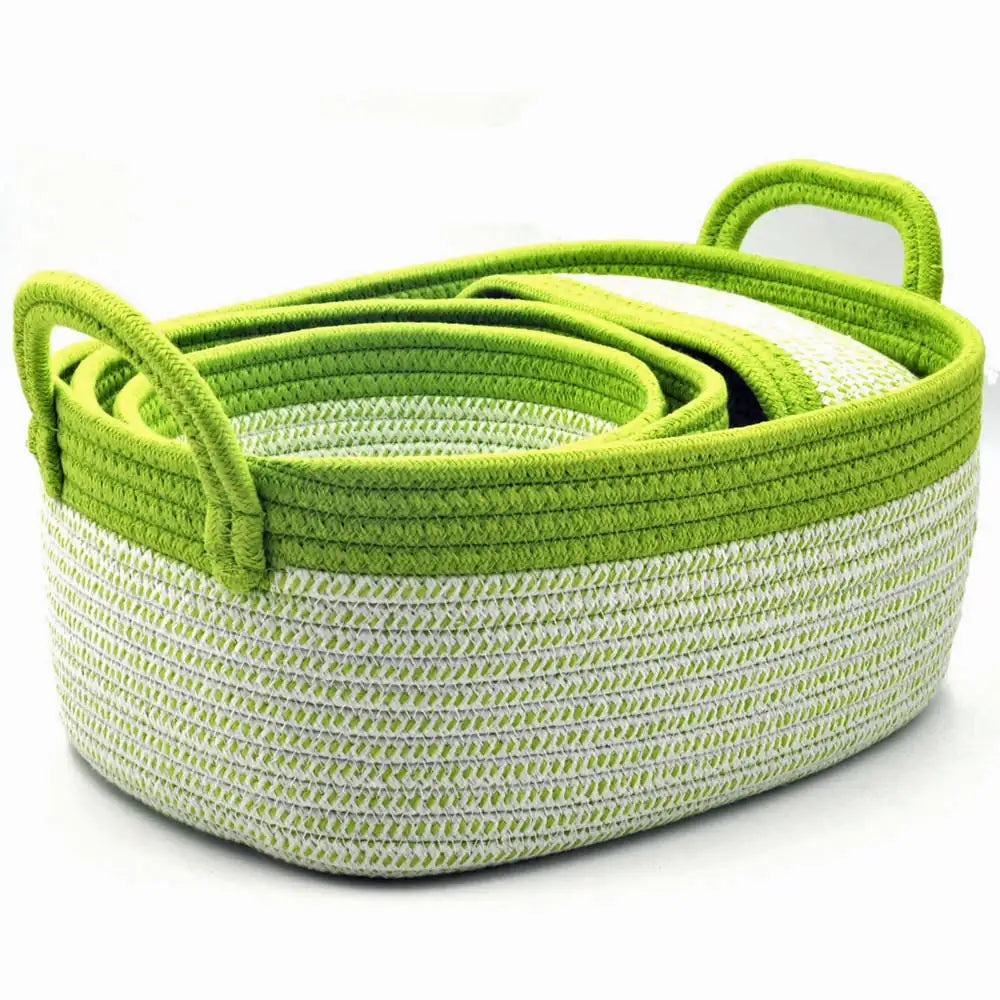 Set of green and white woven baskets on a white background