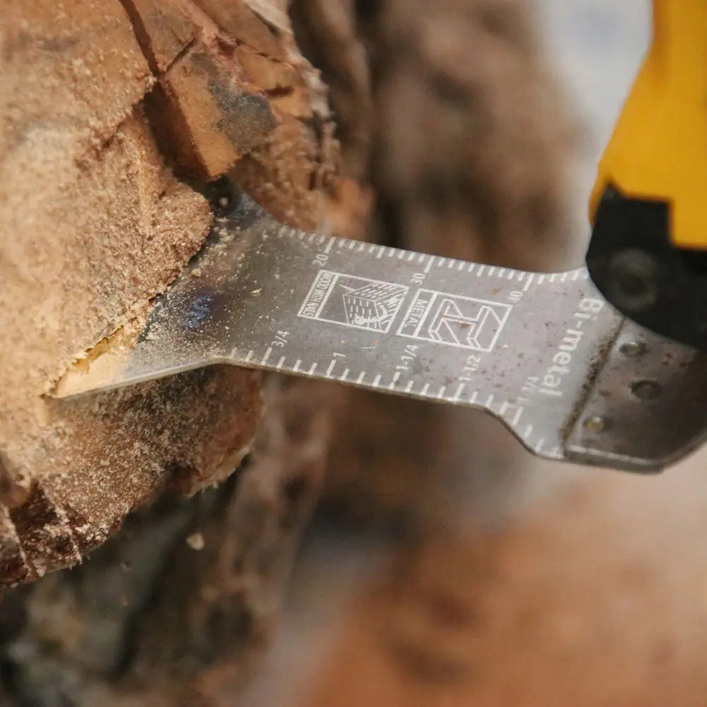 Folding knife with a ruler blade on a wooden surface