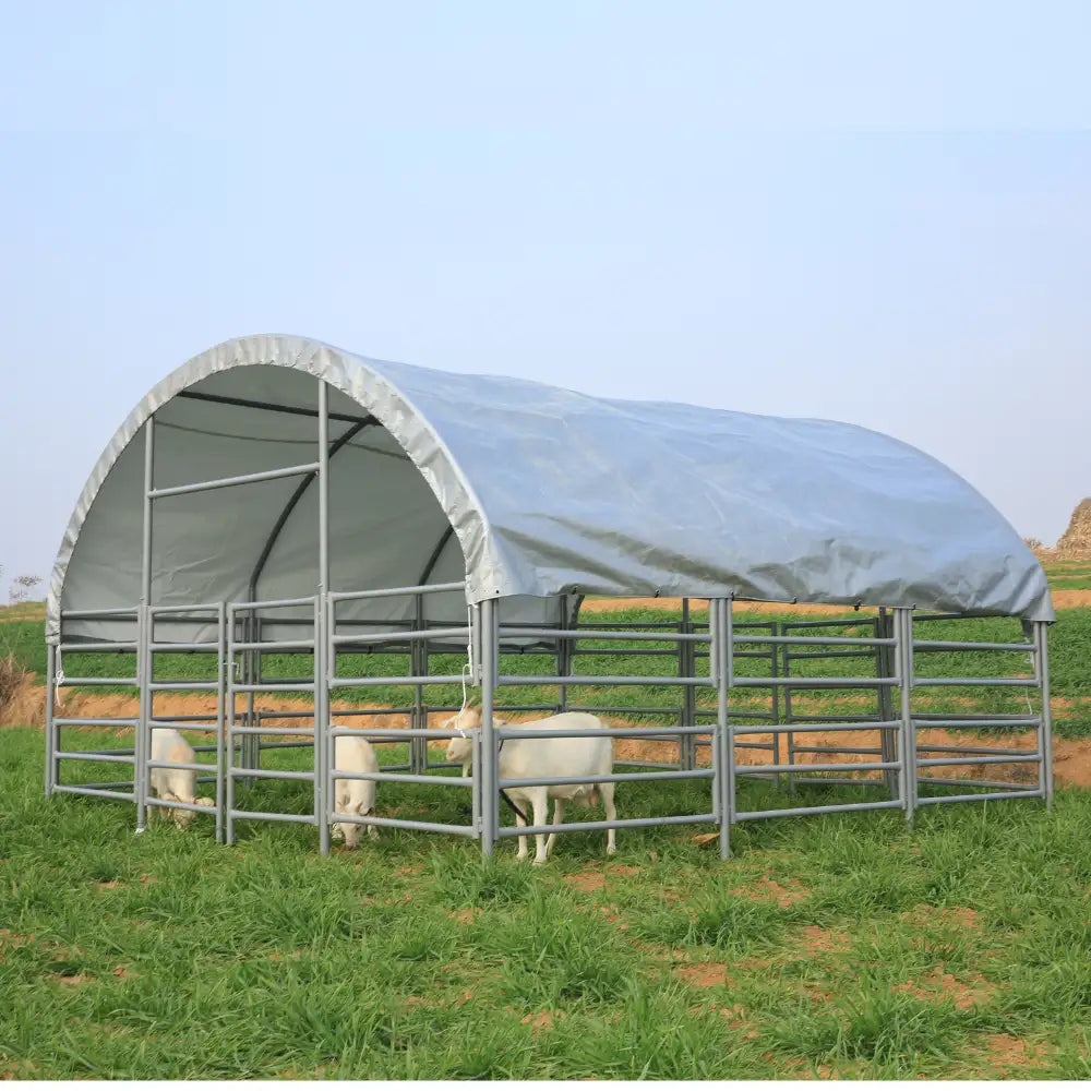 Heavy duty livestock with a cover on a grassy field
