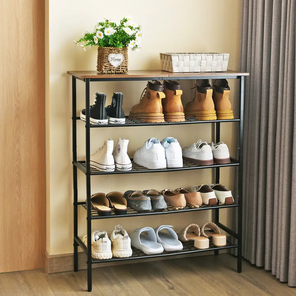 Shoe rack with various shoes on a wooden floor against a neutral wall.