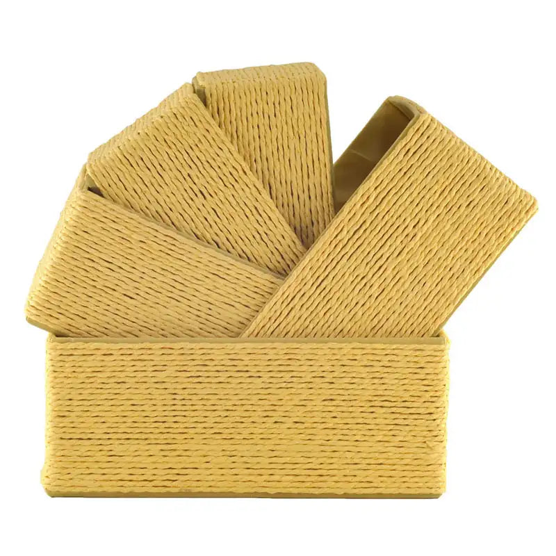 Five Lemon-colored woven paper rope baskets stacked diagonally inside each other
